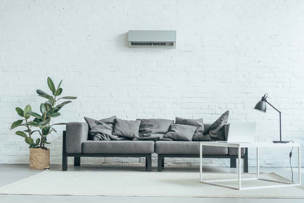 Empty Room With Grey Sofa With Air Conditioner